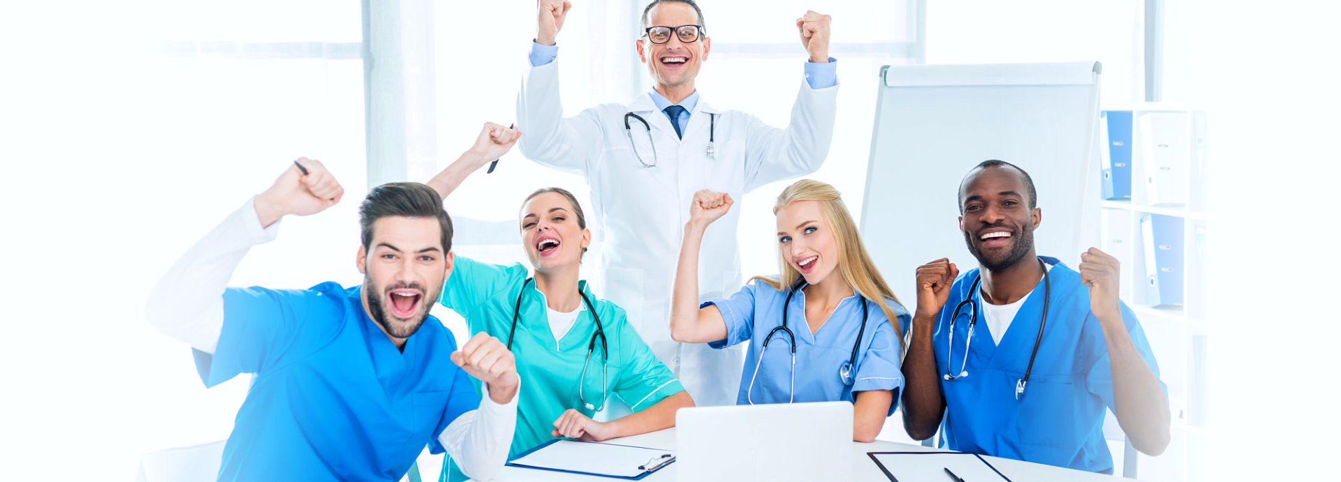 group of a happy doctor and nurses